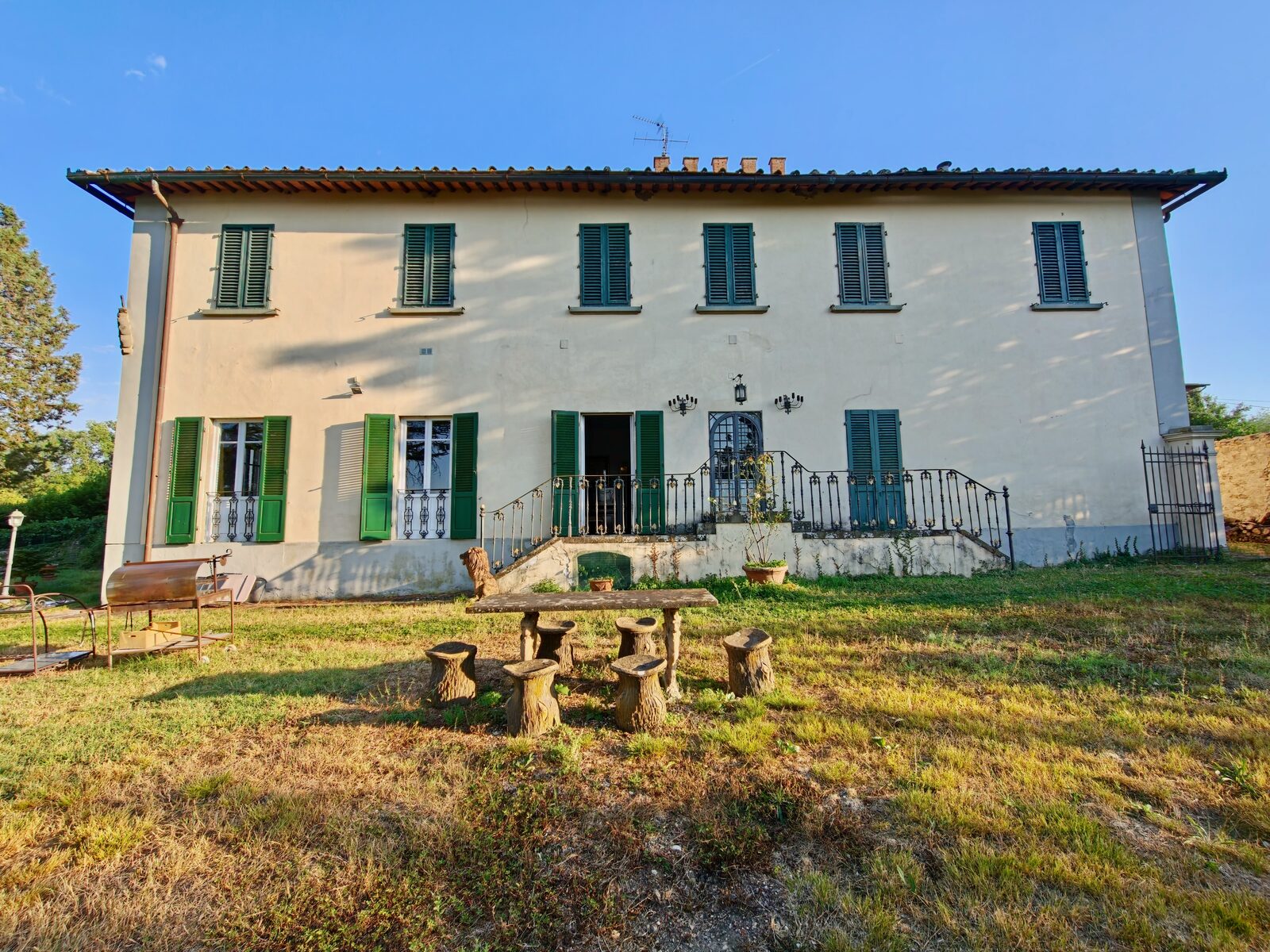 Villa façade with green shutters